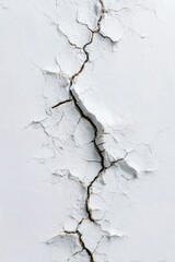 Obraz premium Crack runs vertically through a flaking, rough, and textured white painted surface