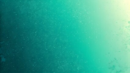 Abstract teal and green gradient with speckled texture background