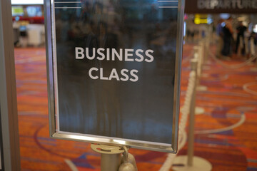 Business class signage at airport terminal during departure
