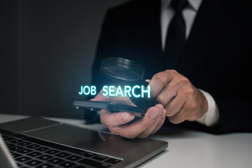 A businessman in a suit using a smartphone with a glowing JOB SEARCH text and magnifying glass icon...
