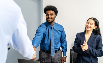 Architect engineer team shake hands and discussing about building construction projects. Group of...