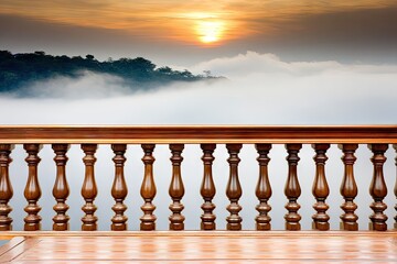 Wooden balcony overlooking misty mountains at sunrise