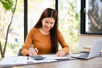 Business financing accounting banking concept. Businesswoman hand doing finances and calculate on...