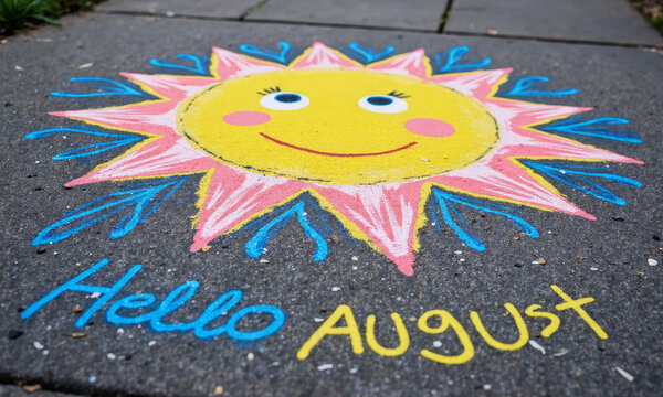 A Close-up of a Child's Colorful Sidewalk Chalk Drawing, Depicting a Large, Smiling Sun, with "Hello August" Written Underneath