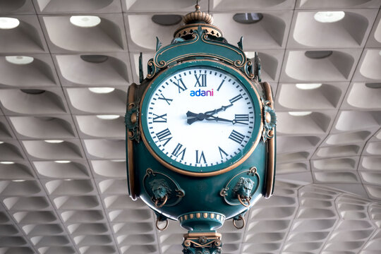 Adani group's vintage clock at Mumbai International airport, Adani is one of the largest Indian Conglomerate