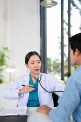 Asian doctor talk with patient about disease symptom, doctor use stethoscope listening lung of...