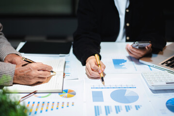 Business People Talking Discussing with financial document data charts and graphs Team business...