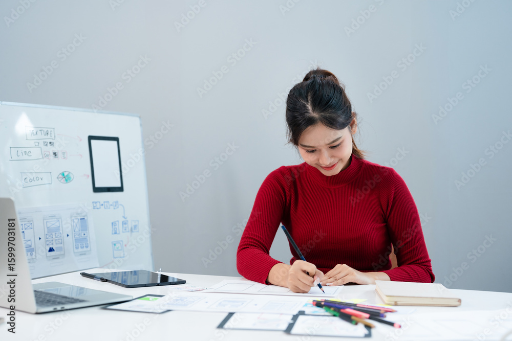 Fototapete Website development UI UX front end designer sketching wireframe layout design mockup for responsive web content in bright modern office.