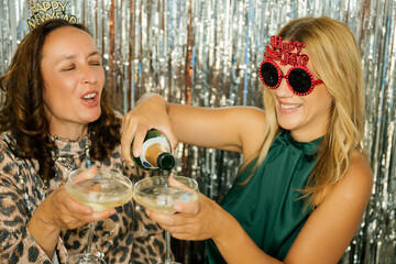 Two happy women celebrating new year's eve