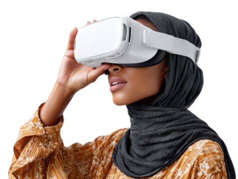 Virtual Reality Immersion: A woman with a hijab explores virtual reality with VR glasses, symbolizing technological innovation and futuristic experience.