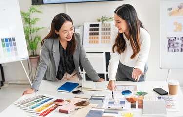 Woman architect designer teamwork select material compare samples finishing. Female interior...