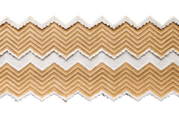 A zigzag patterned fabric with a torn edge is isolated on a transparent background