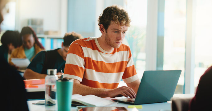 Laptop, college and typing with man in classroom for software bootcamp, web developer and research. Programmer course, coding scholarship and studying with male person on campus for tech lecture