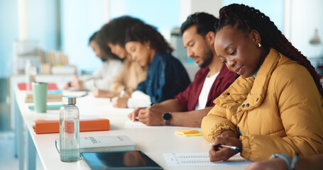 University, education and students in classroom, test and knowledge with research. Academy, men and women with exam, college and learning with development, scholarship and assignment with information