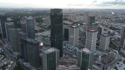 View of Guangzhou Wanbo skyline at sunset with bustling city activity and modern architecture