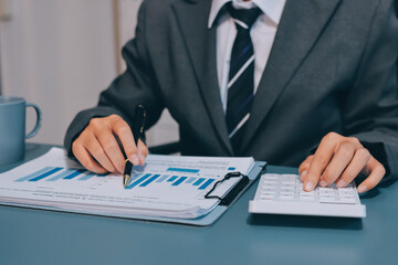 Business financing accounting banking concept. Business woman hand doing finances and calculate on...