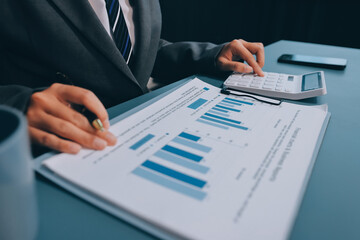 Business financing accounting banking concept. Business woman hand doing finances and calculate on...