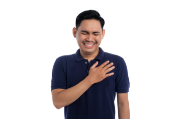 Young man touching chest with eyes closed and emotional expression isolated on transparent background