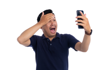 Shocked man holding smartphone and touching forehead with surprised facial expression isolated on transparent background