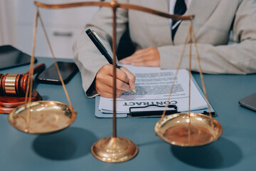 Judge gavel with Justice lawyers having team meeting at law firm background. Concepts of Law and...