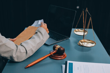 Judge gavel with Justice lawyers having team meeting at law firm background. Concepts of Law and...