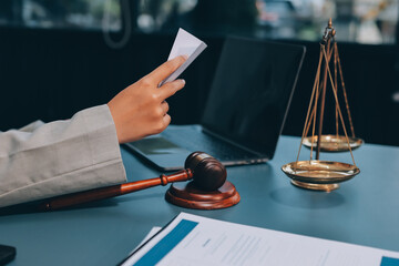 Judge gavel with Justice lawyers having team meeting at law firm background. Concepts of Law and...