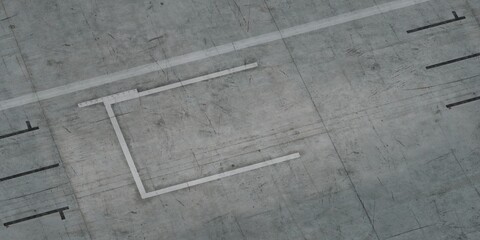 Fototapeta premium Aerial view of an empty concrete runway with painted lines and markings.