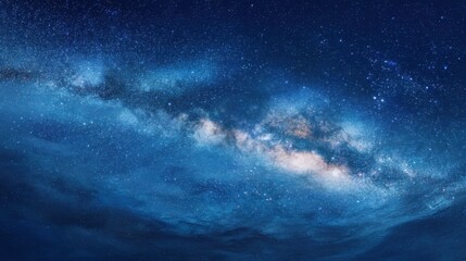 Fototapeta premium A stunning expanse of the night sky showcases brilliant stars and distant galaxies, creating a breathtaking celestial display over a tranquil landscape. The vastness invites reflection and awe.