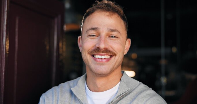 Cafe, happy man and owner of small business with portrait, confidence and hospitality industry. Smile, barista and male person at coffee shop, waiter and professional at door of startup in Australia