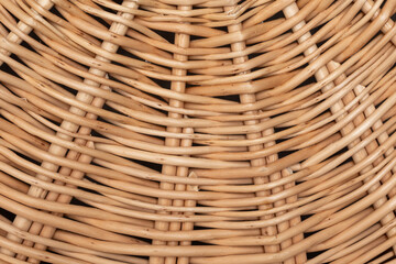 The detailed craftsmanship of this wicker basket showcases intricate weaving patterns. The warm...