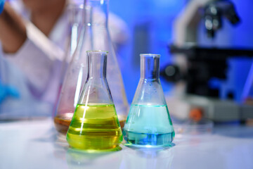 Chemical solutions in glassware during lab experiment