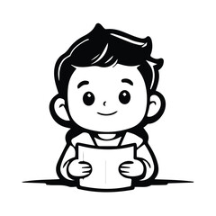 Young boy in casual clothing seated at a table, holding a book. Student engrossed in reading activity in a classroom setting.