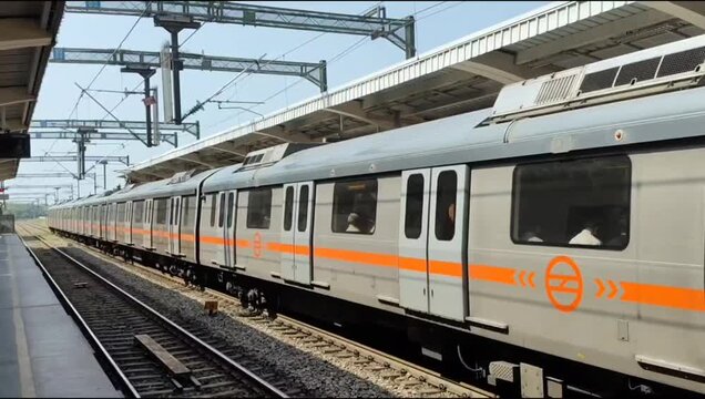 New Delhi, India, April 16 2025 - Delhi Metro train arriving at Jhandewalan metro station in New Delhi, India, Asia, Public Metro departing from Jhandewalan station