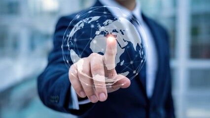 Businessman touching a digital globe network, symbolizing global connectivity and technology.