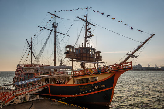 Osaka, Japan &ndash; July 12, 2025: Santa Maria sightseeing cruise ship docked at harbor during golden hour.