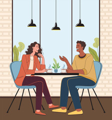Joyful Conversation Between Friends at a Cozy Cafe, Two Friends Laughing and Talking at a Cafe Table