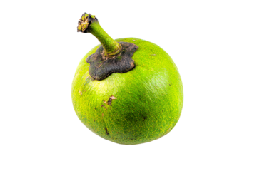 a green fruit with a brown spot on it