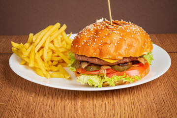 A delicious gourmet burger with crispy fries on the side awaits your enjoyment