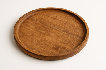 Circular wooden tray resting on a surface.