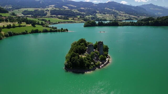 Lake Gruy&egrave;re Le Bry island Switzerland aerial drone ruined castle turquoise blue color landmark