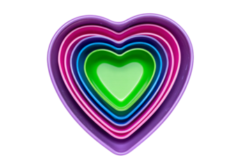 a stack of colorful heart shaped bowls on a white surface