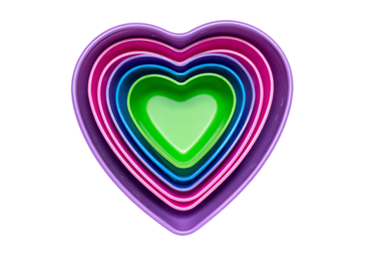 a stack of colorful heart shaped bowls on a white surface