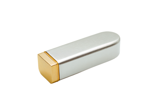 a silver and gold metal object on a white surface
