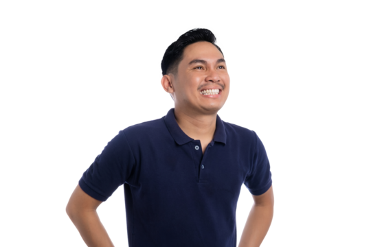 Smiling Asian man standing with hands on hips and looking up with hopeful and confident expression isolated on transparent background