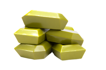 a pile of yellow soap blocks on a white surface