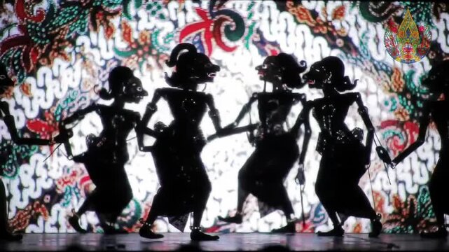 A stunning digital performance of traditional Indonesian wayang kulit with silhouettes animated by augmented reality and tech projection, blending heritage with innovation.