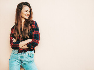 Portrait of beautiful smiling model. Sexy female dressed in summer hipster checkered shirt and...