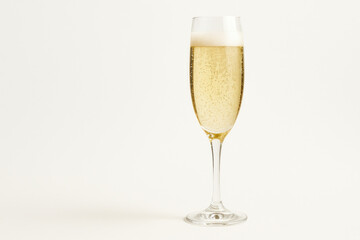 A glass of champagne on a white background.