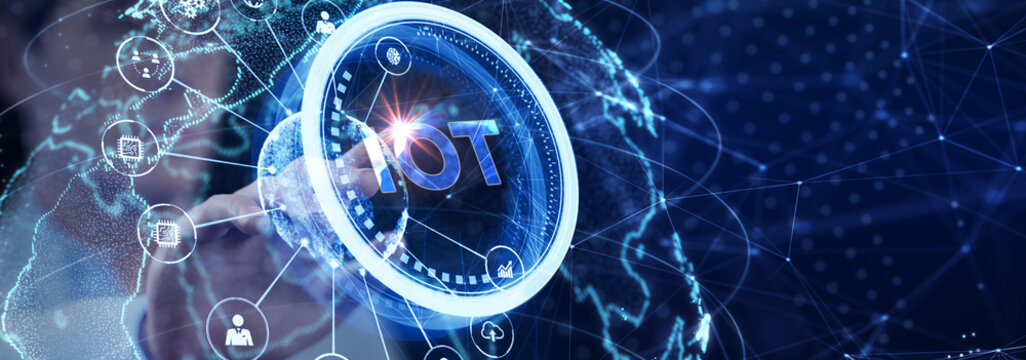 Internet of things - IOT concept. Businessman offer IOT products and solutions. The future of technology. Virtual screen of the future with the inscription: IOT.