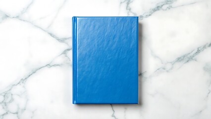 A single closed blue hardcover book with a textured cover viewed from directly above isolated on white background